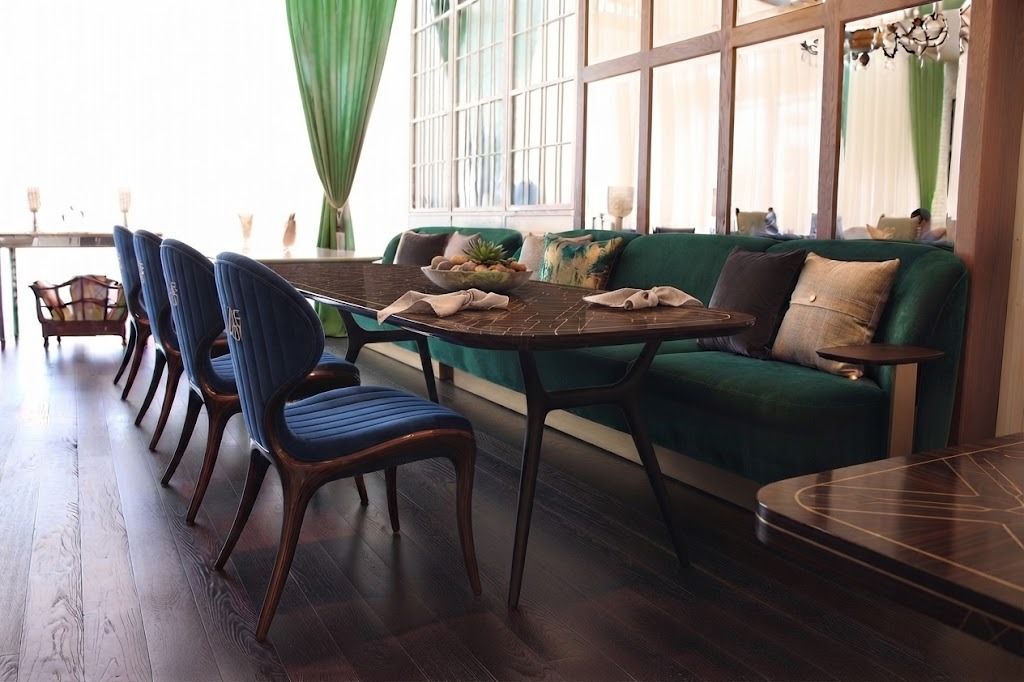 Restaurant banquette seating with navy dining chairs